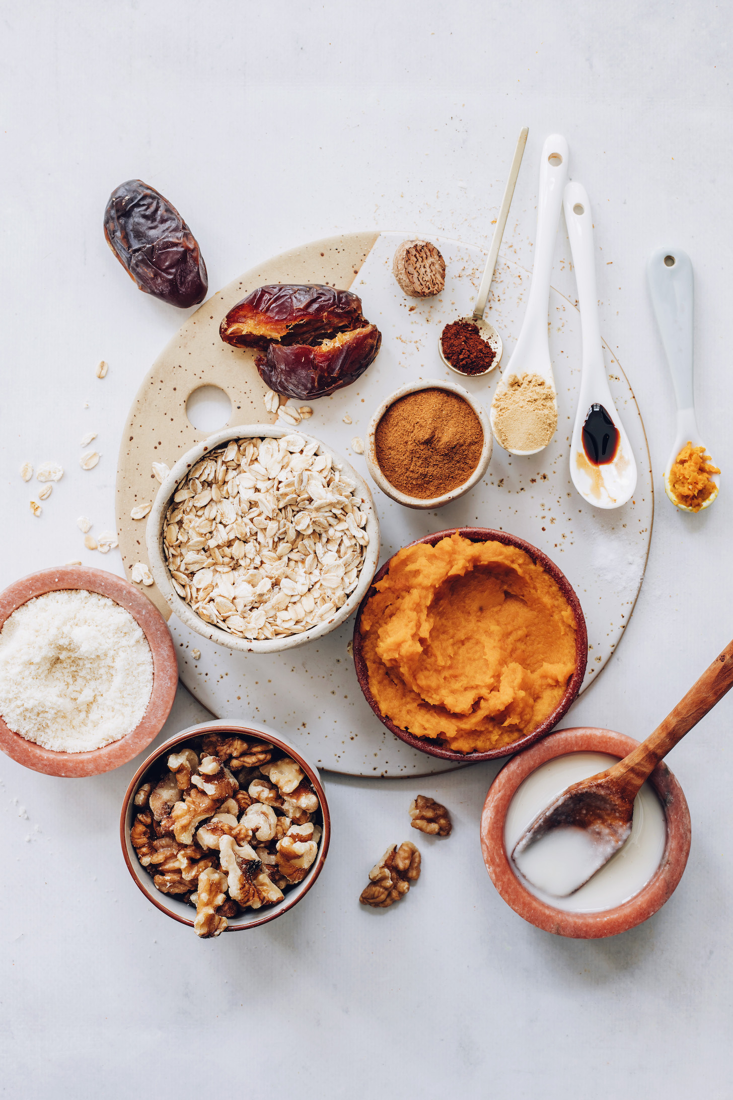 Dates, spices, vanilla, coconut butter, pumpkin purée, walnuts, almond flour, and oats