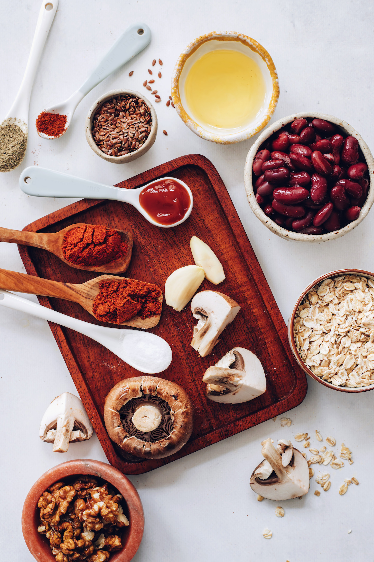 Walnuts, oats, mushrooms, garlic, kidney beans, ketchup, spices, salt, avocado oil, and flax seeds