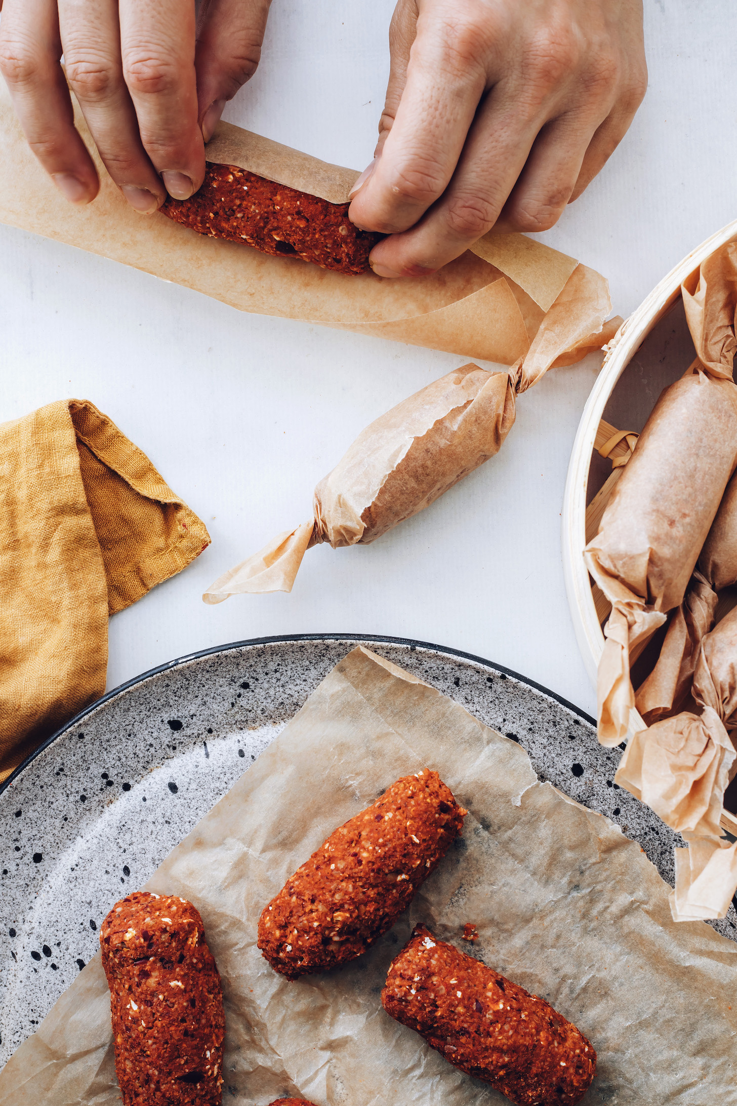 Wrapping chorizo links in parchment paper