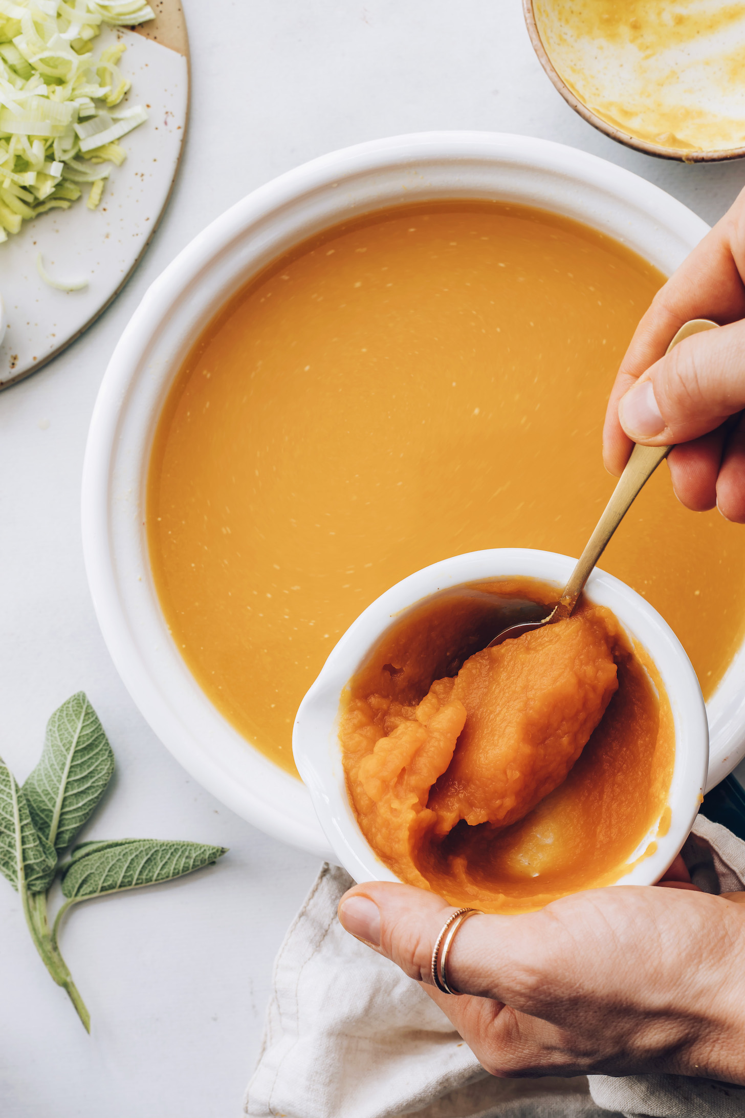 Adding pumpkin to a saucepan to make miso pumpkin broth