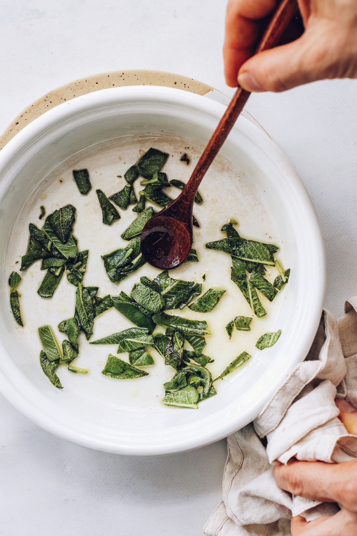 Making crispy fried sage in a pan