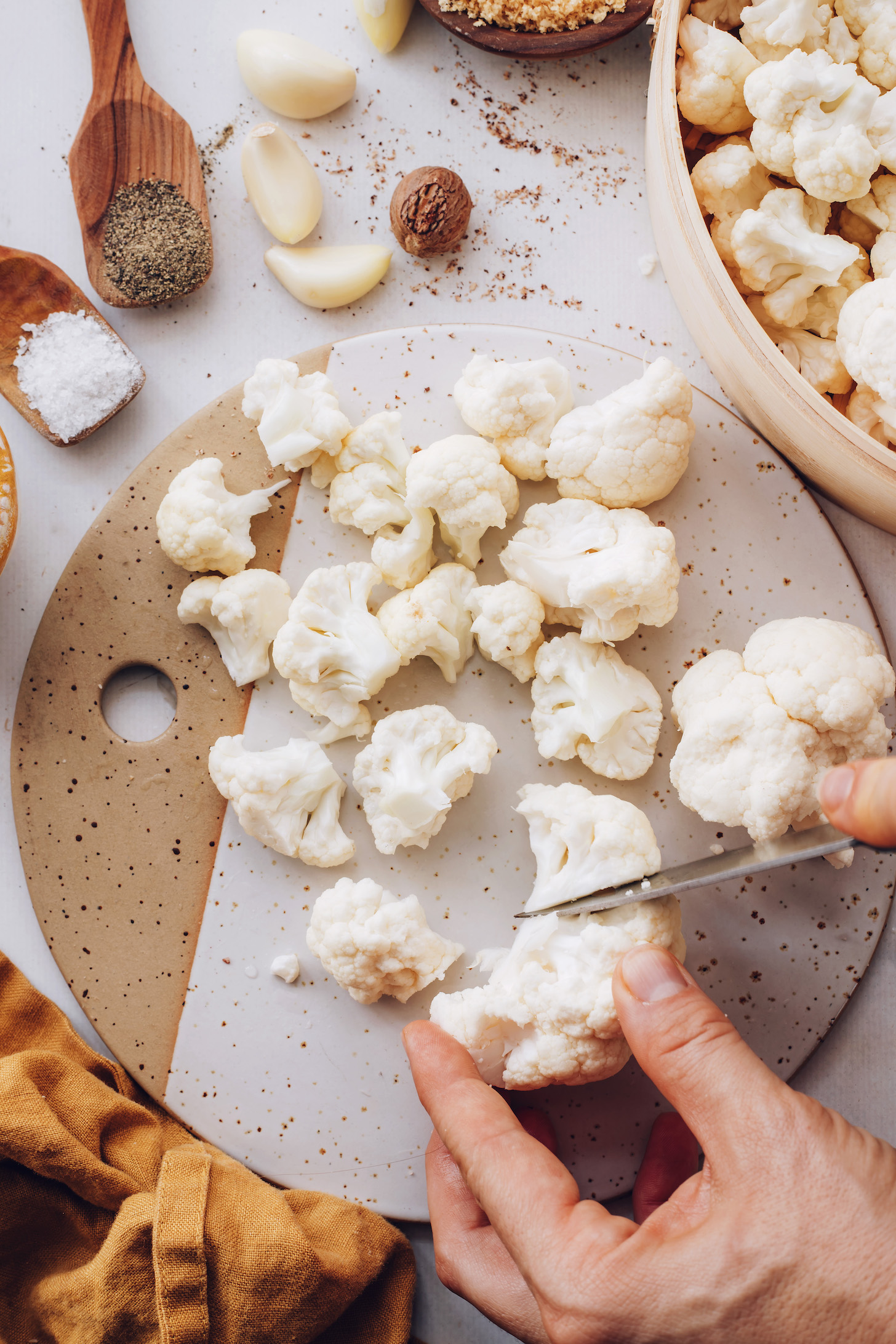 Chopping cauliflower into florets