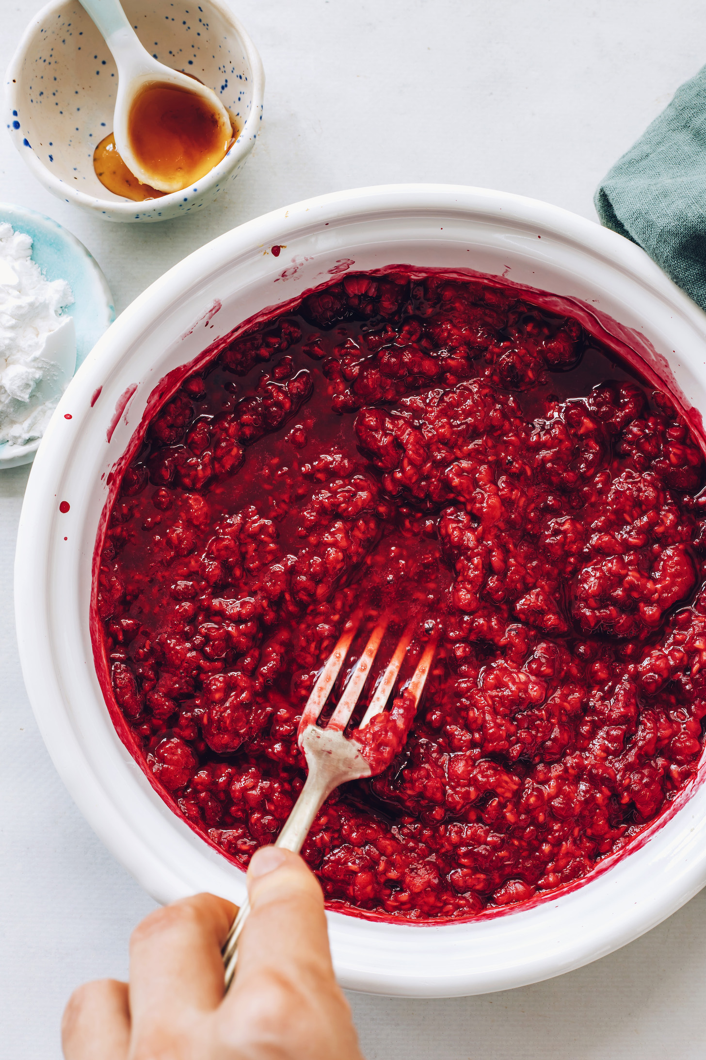 Cooking raspberry sauce in a saucepan