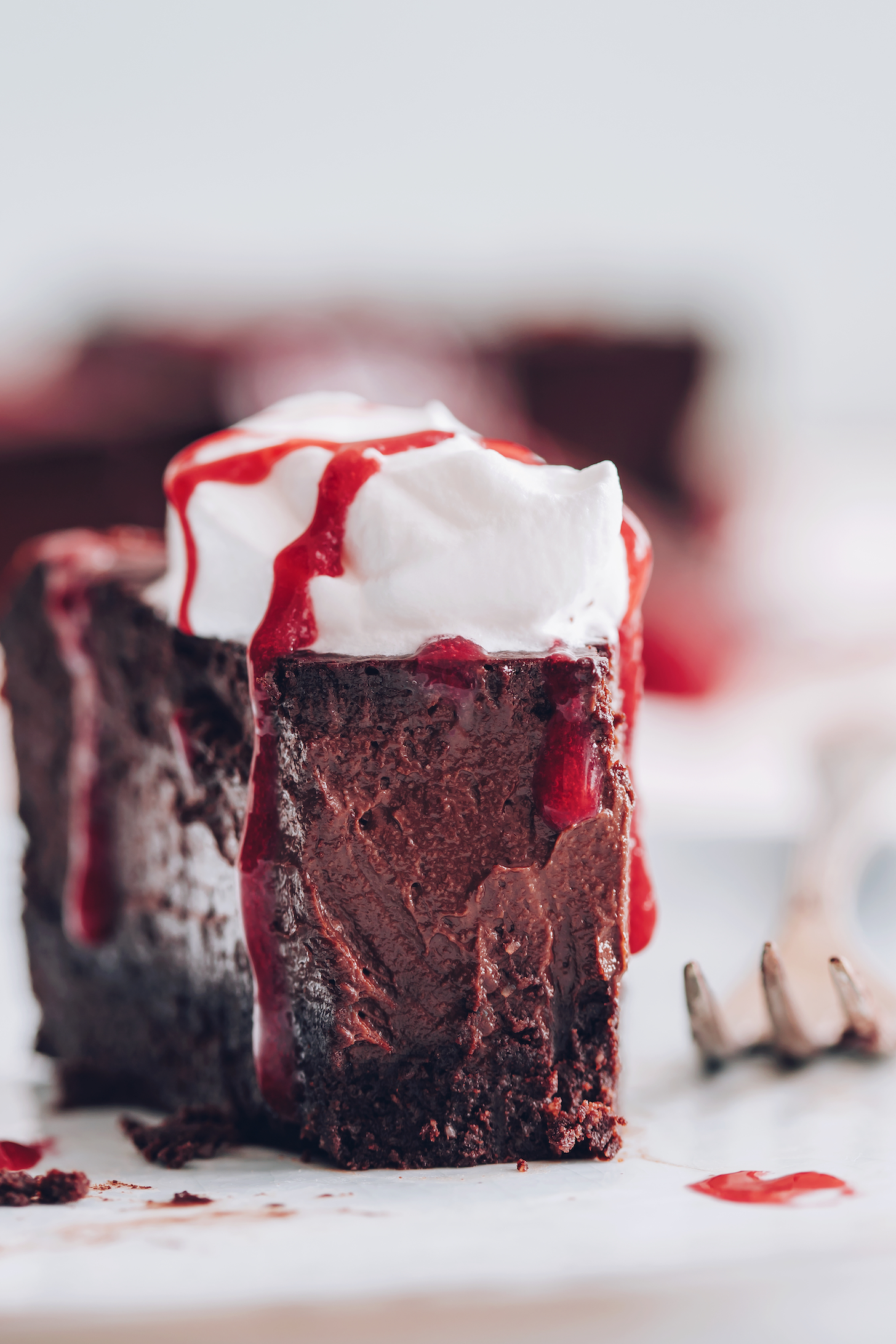 Showing the filling texture of a slice of vegan chocolate cheesecake