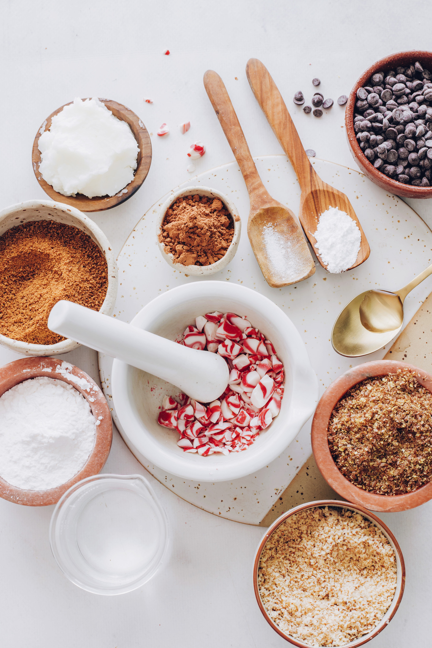 Coconut oil, coconut sugar, tapioca flour, water, crushed candy canes, almond flour, flaxseed meal, peppermint extract, salt, baking powder, and chocolate chips