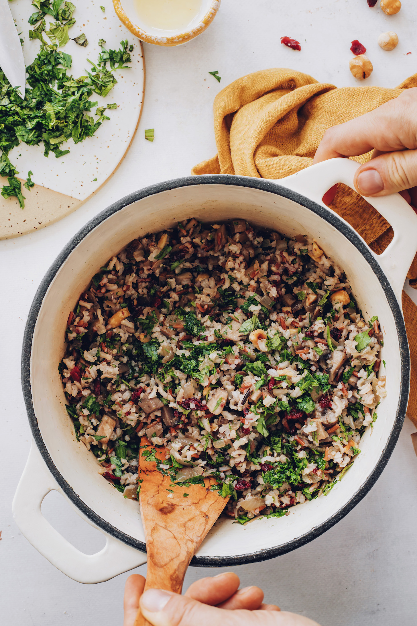 Stirring fresh herbs into wild rice salad