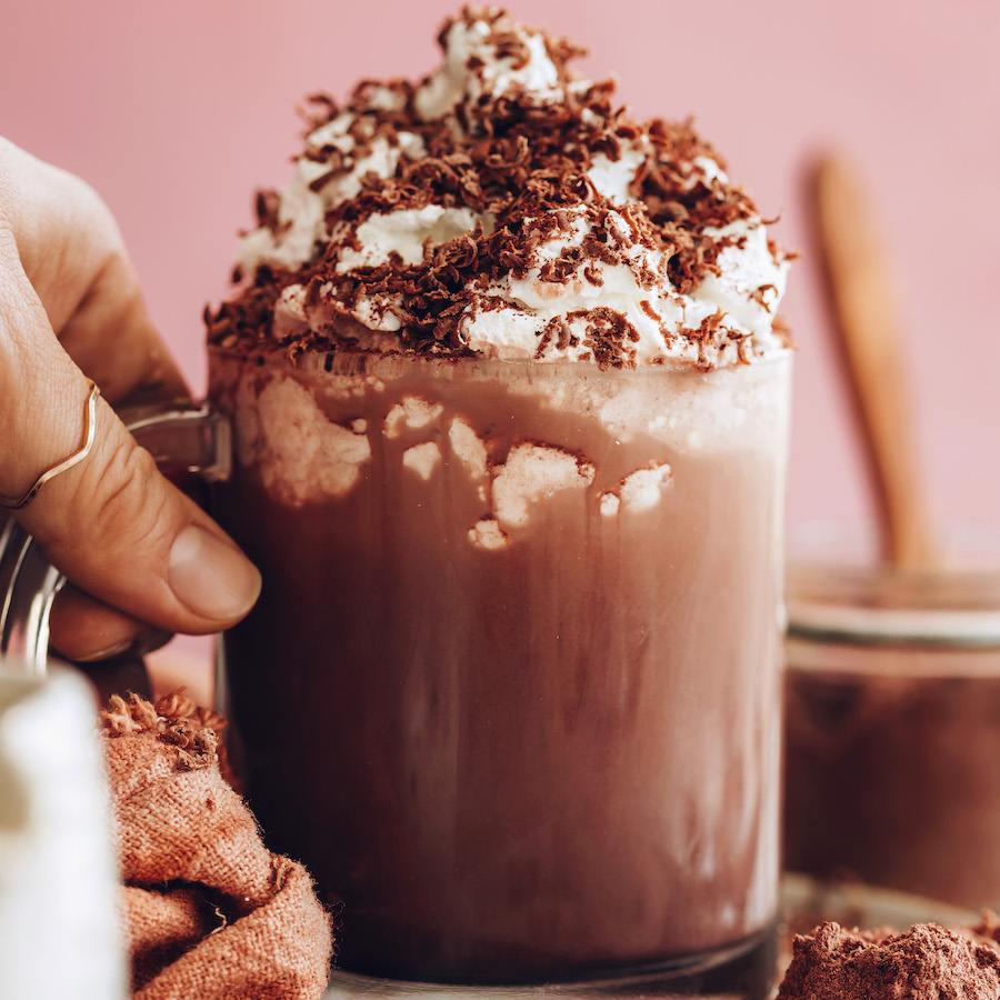 Holding the handle of a mug of instant hot chocolate