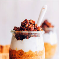 Jar of vegan and gluten-free pumpkin pie overnight oats with coconut yogurt and granola on top