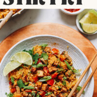 Bowl of our spaghetti squash stir-fry with text above it that says vegan and gluten-free