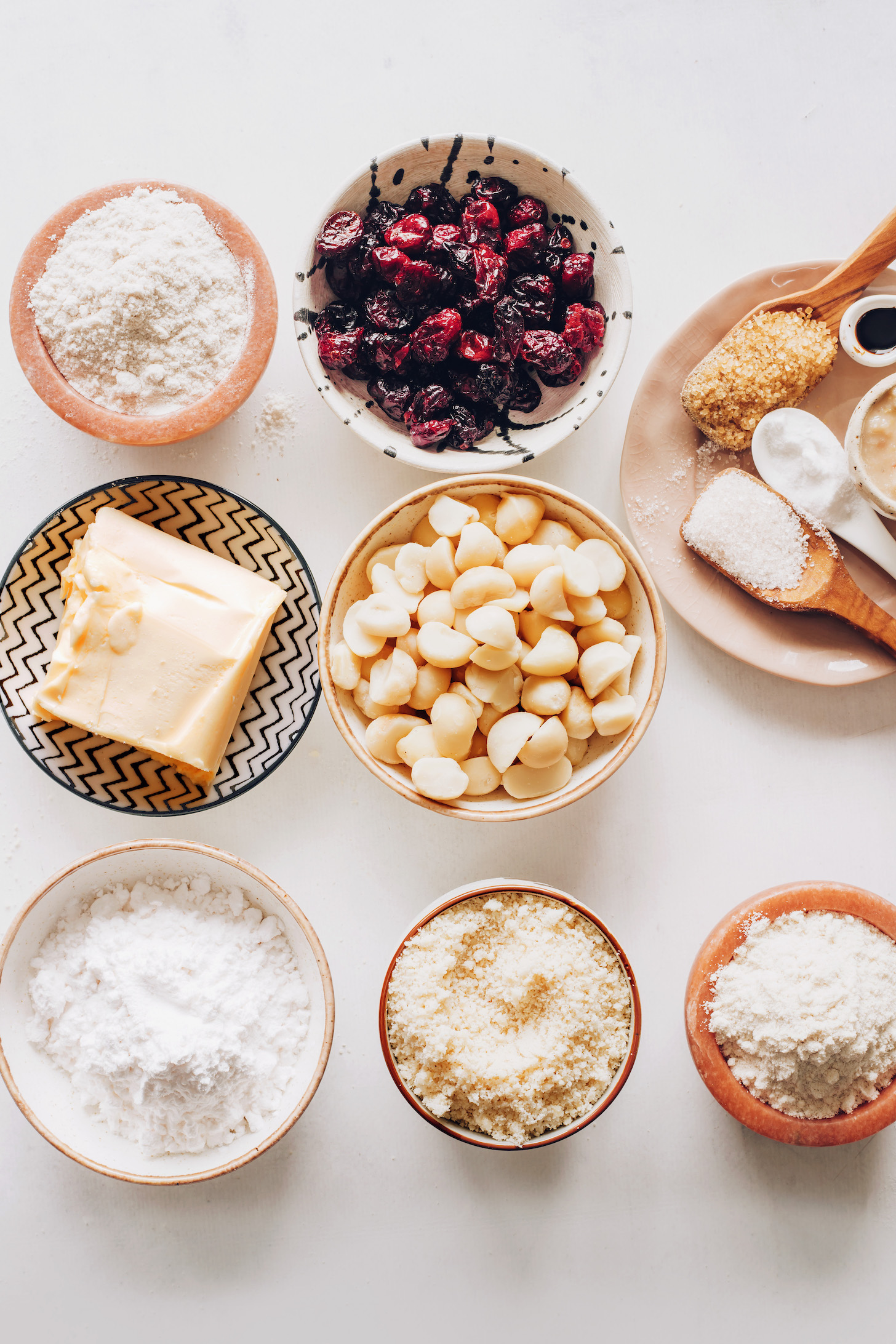 Almond flour, sorghum flour, tapioca starch, brown rice flour, macadamia nuts, vegan butter, cranberries, brown sugar, cane sugar, baking soda, applesauce, and vanilla