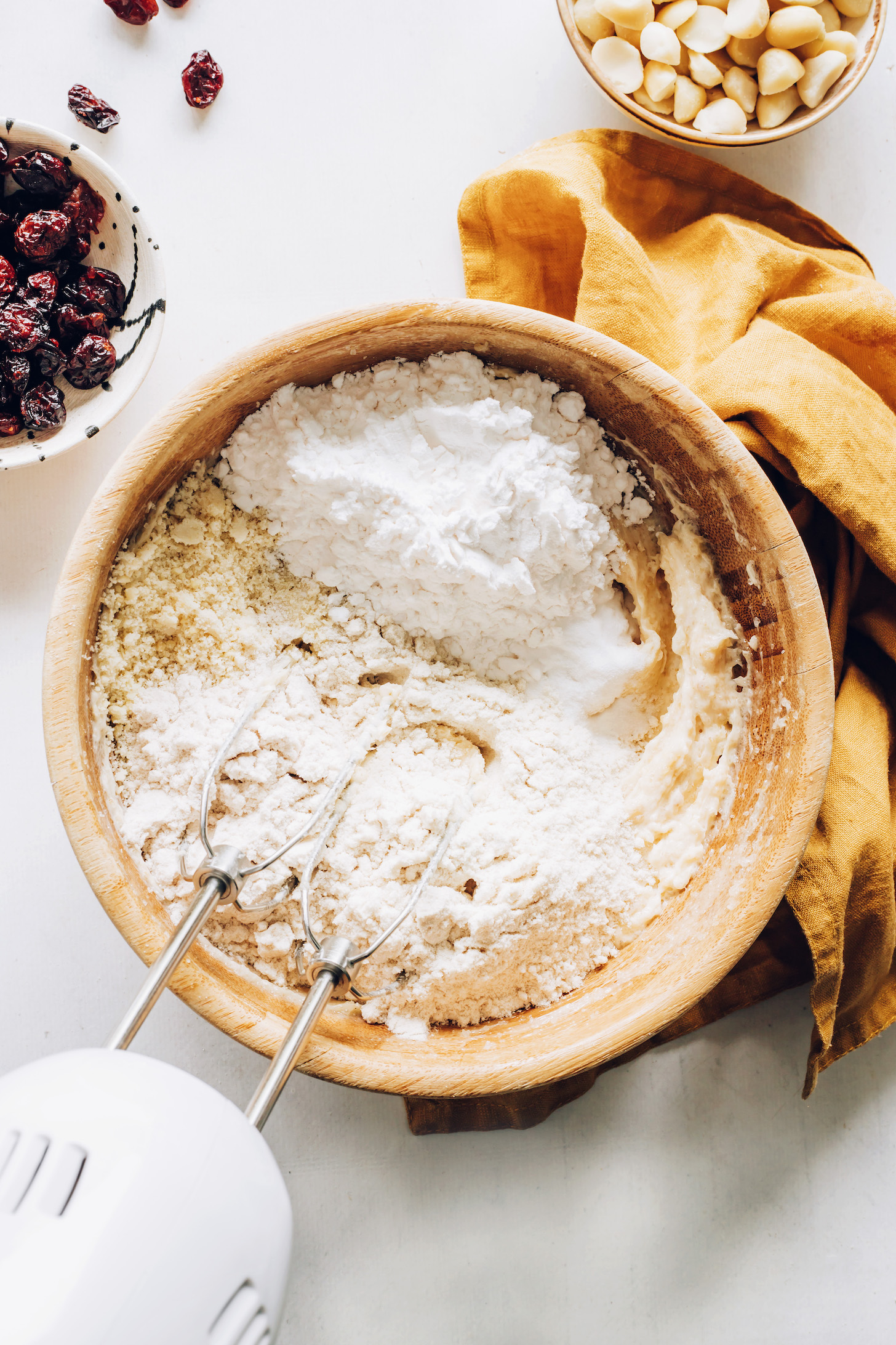 Using a hand mixer to combine wet and dry ingredients