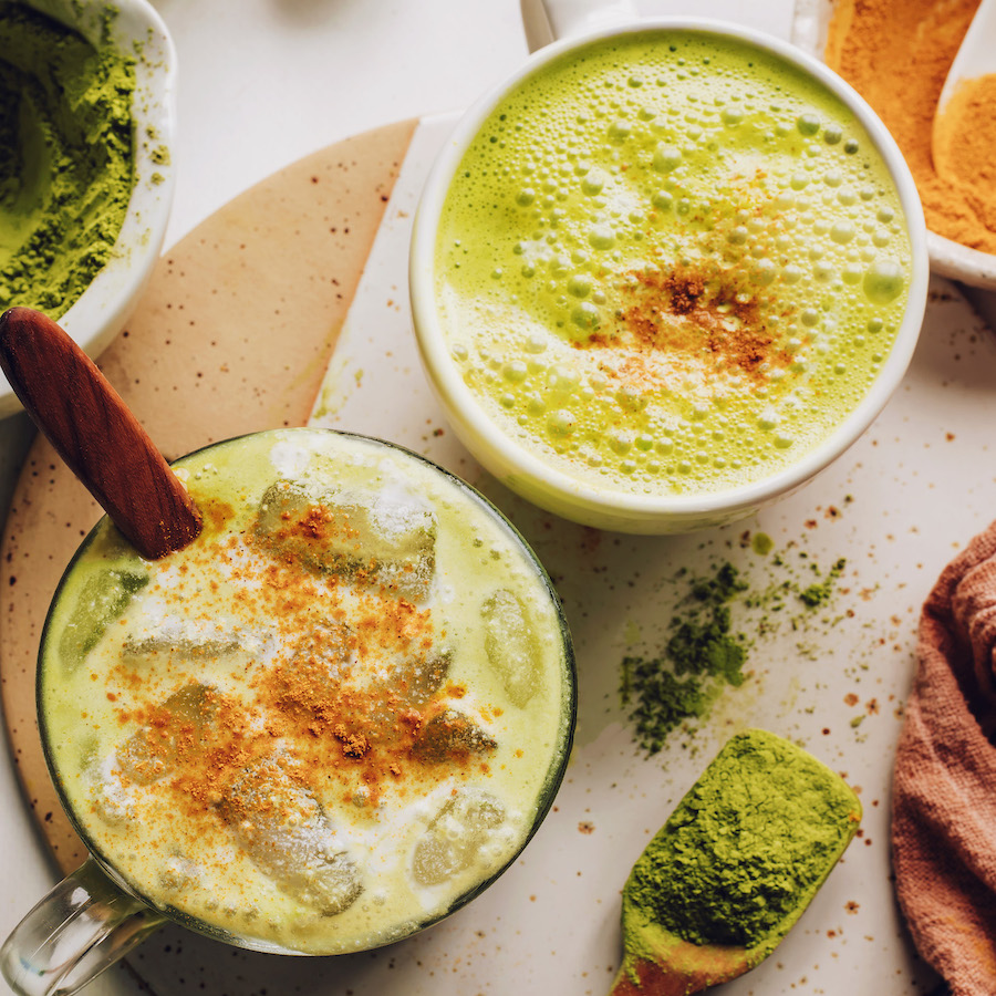 Top down shots of mugs filled with golden matcha lattes