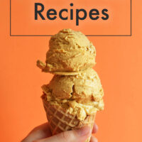 Hand holding a cone of vegan pumpkin ice cream