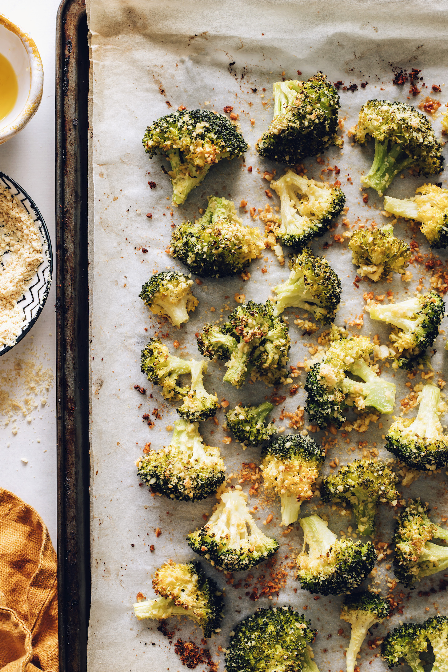 Baking sheet with golden brown oven roasted broccoli