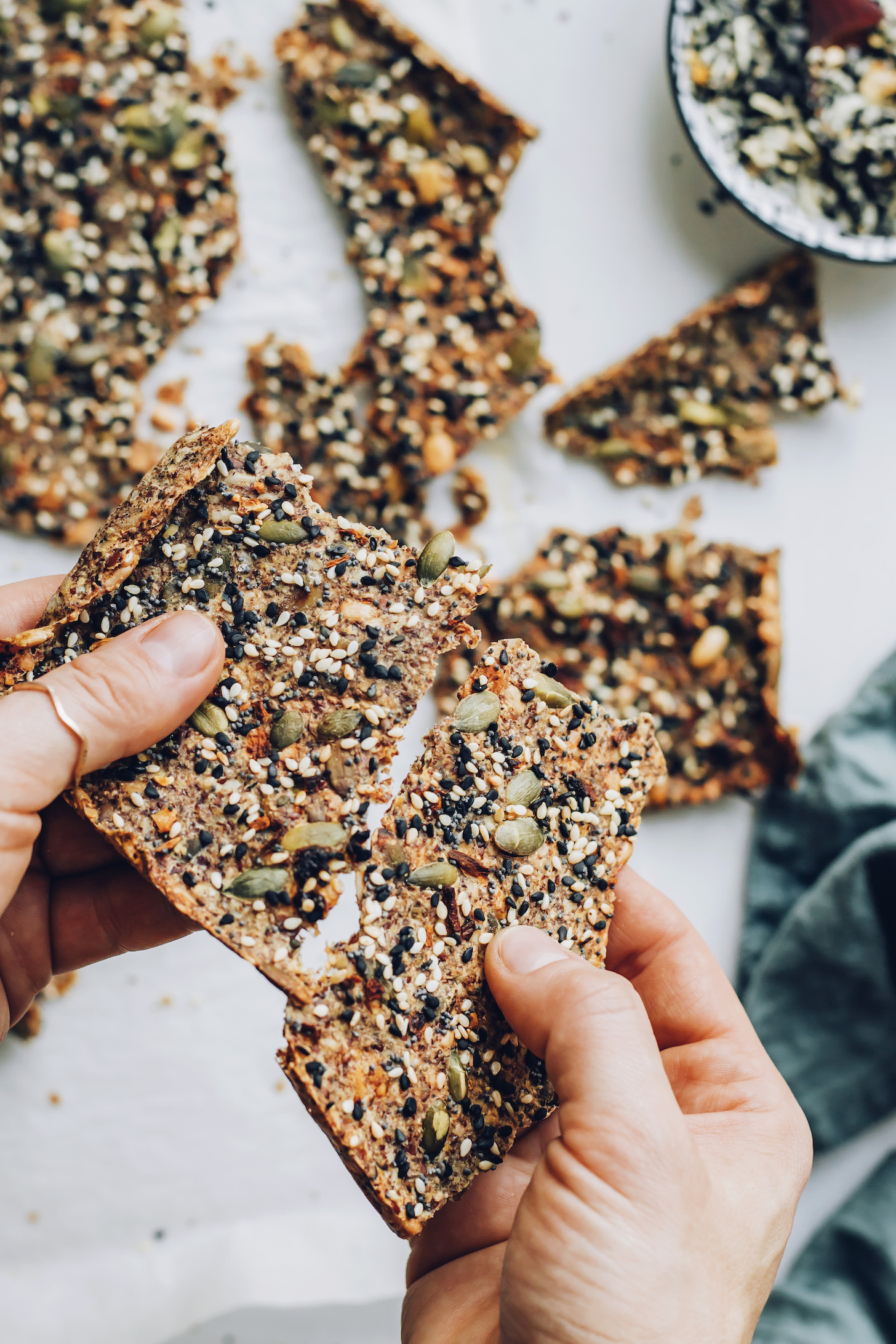 Holding a seed cracker snapped into two pieces