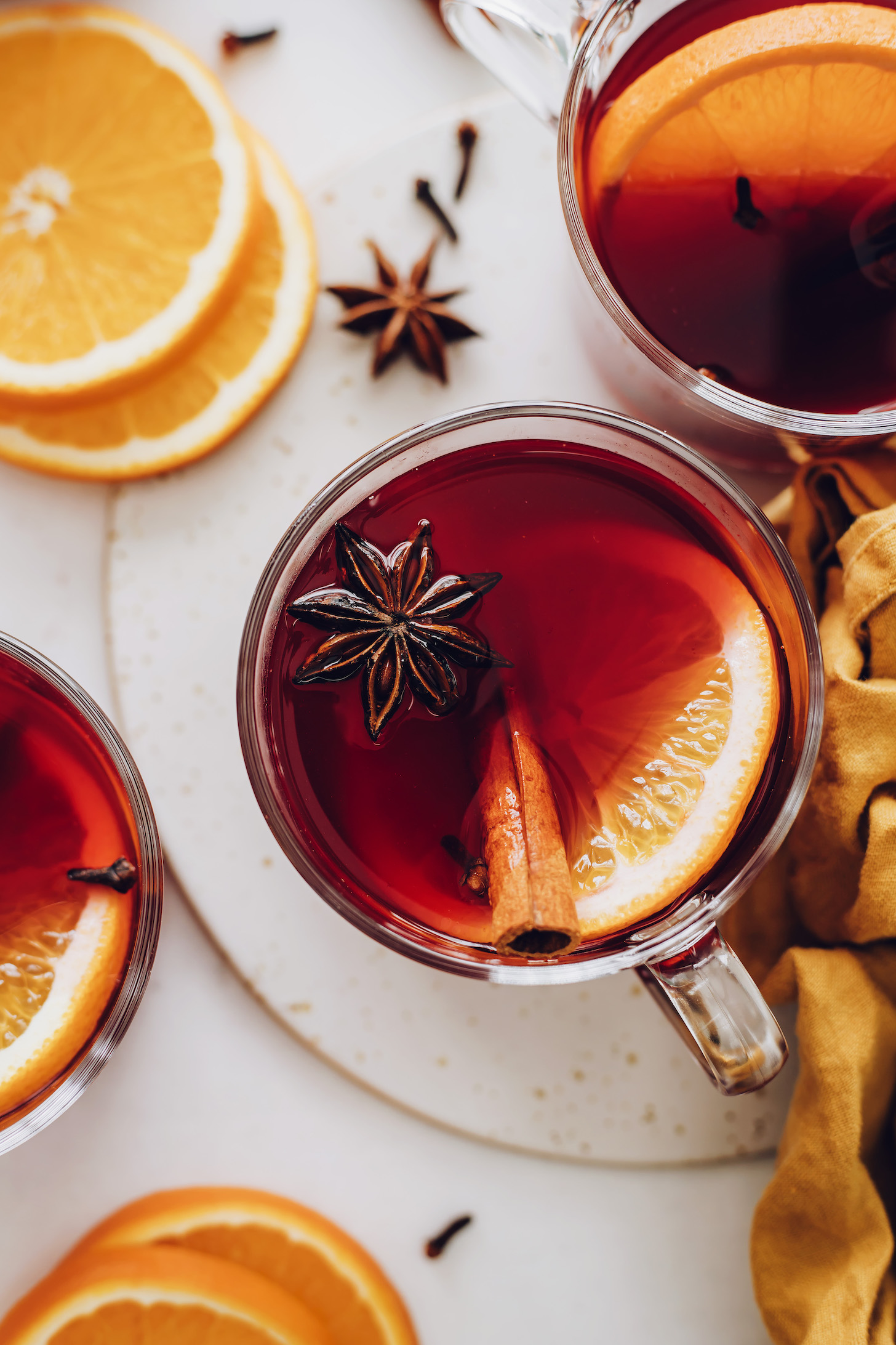 Close up shot of mugs of non-alcoholic tart cherry mulled "wine"