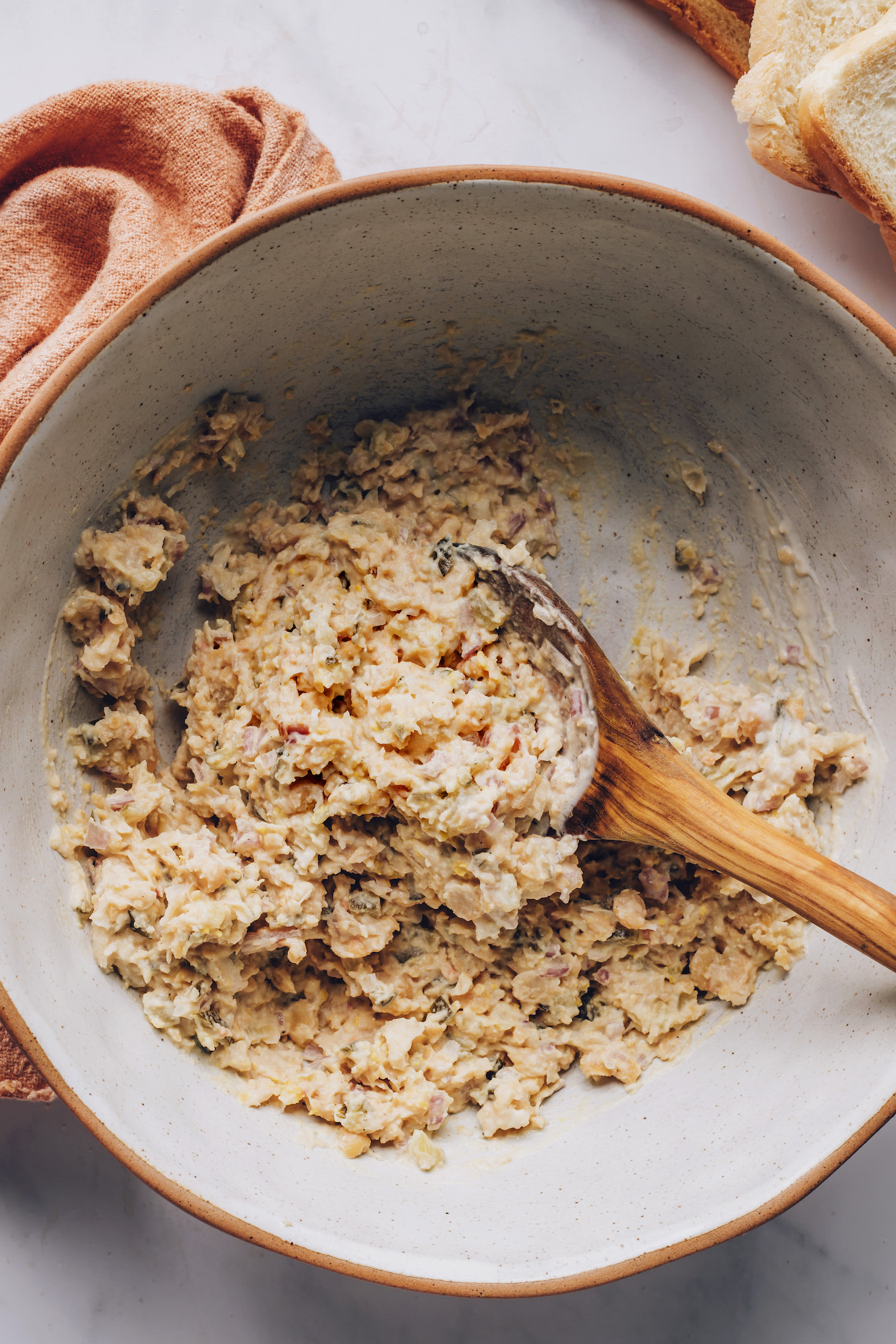 Wooden spoon in a bowl of chickpea filling