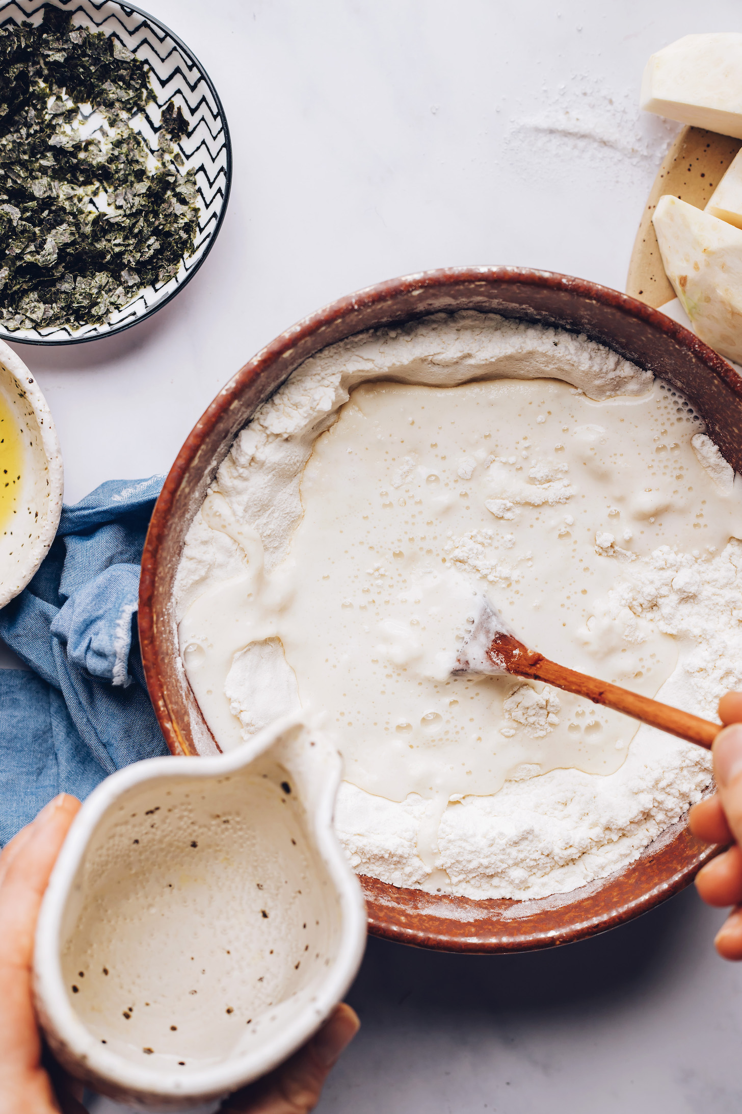 Adding water to a boil of gluten-free flour blend and salt