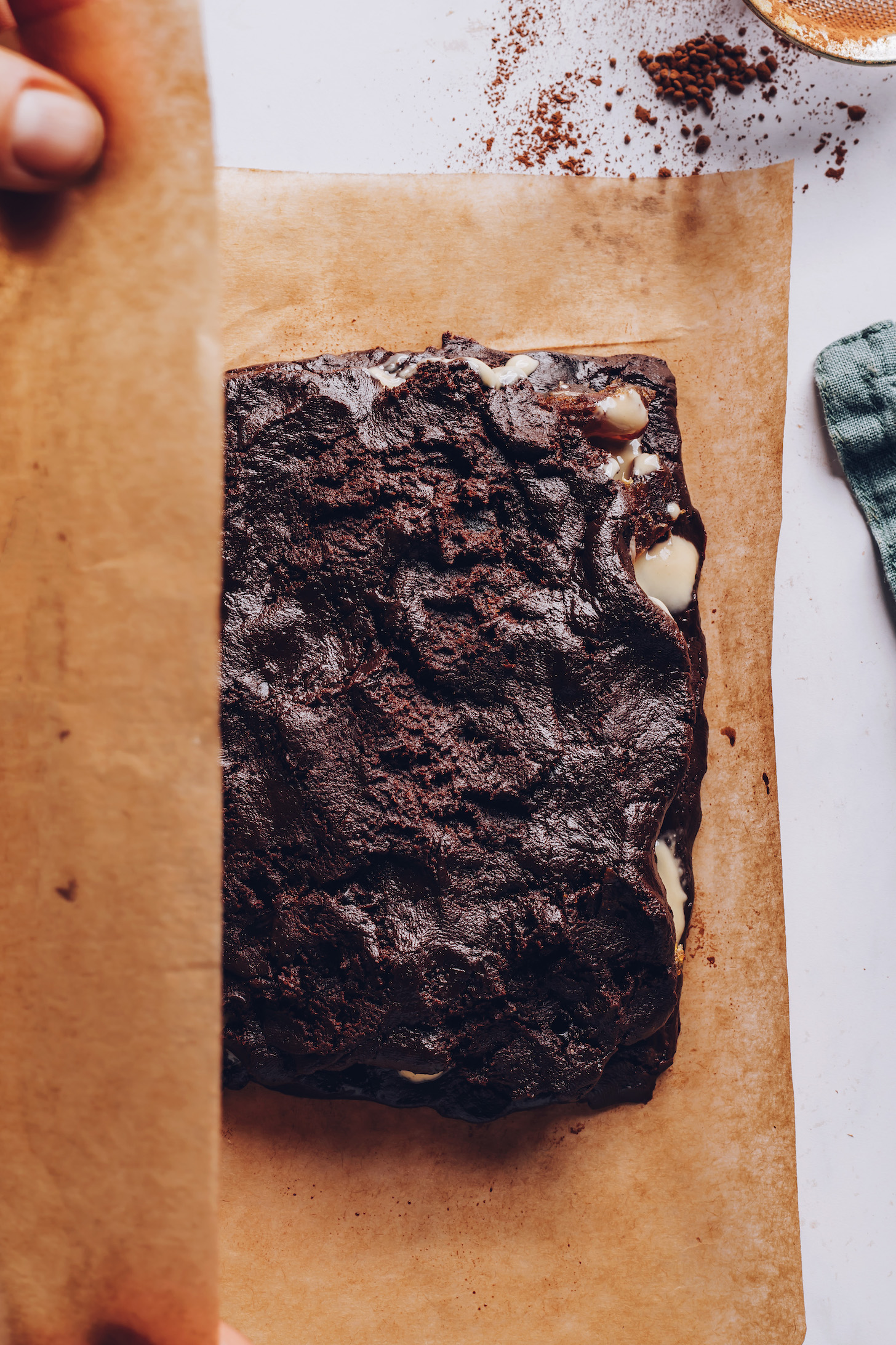 Tahini and dates peeking out from under a layer of chocolate