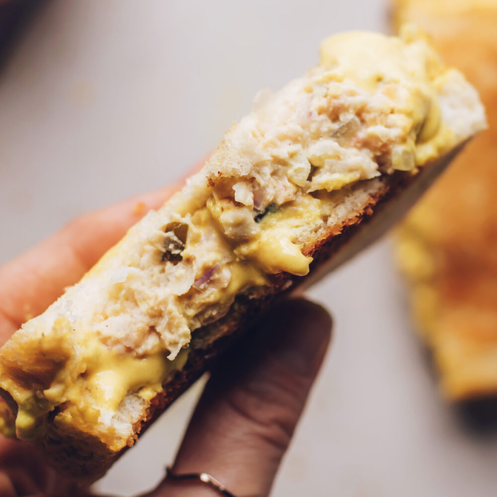 Holding a vegan tuna melt