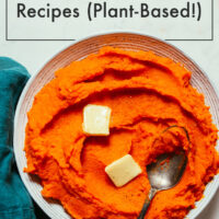 Plate of vegan mashed sweet potatoes and carrots with pats of vegan butter on top