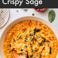 Pan of vegan pumpkin risotto with crispy sage