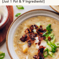Spoon in a bowl of creamy vegan potato leek soup