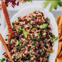 Plate of vegan and gluten-free wild rice salad with mushrooms and herbs