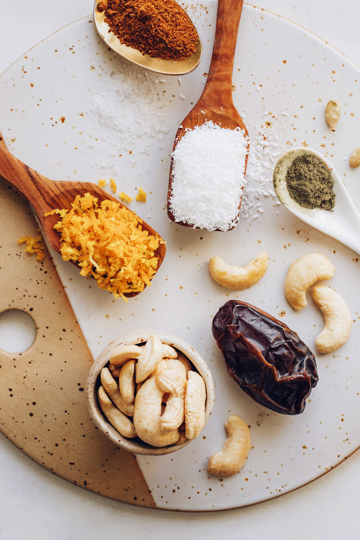 Coconut sugar, salt, orange zest, cashews, medjool date, cardamom, and coconut