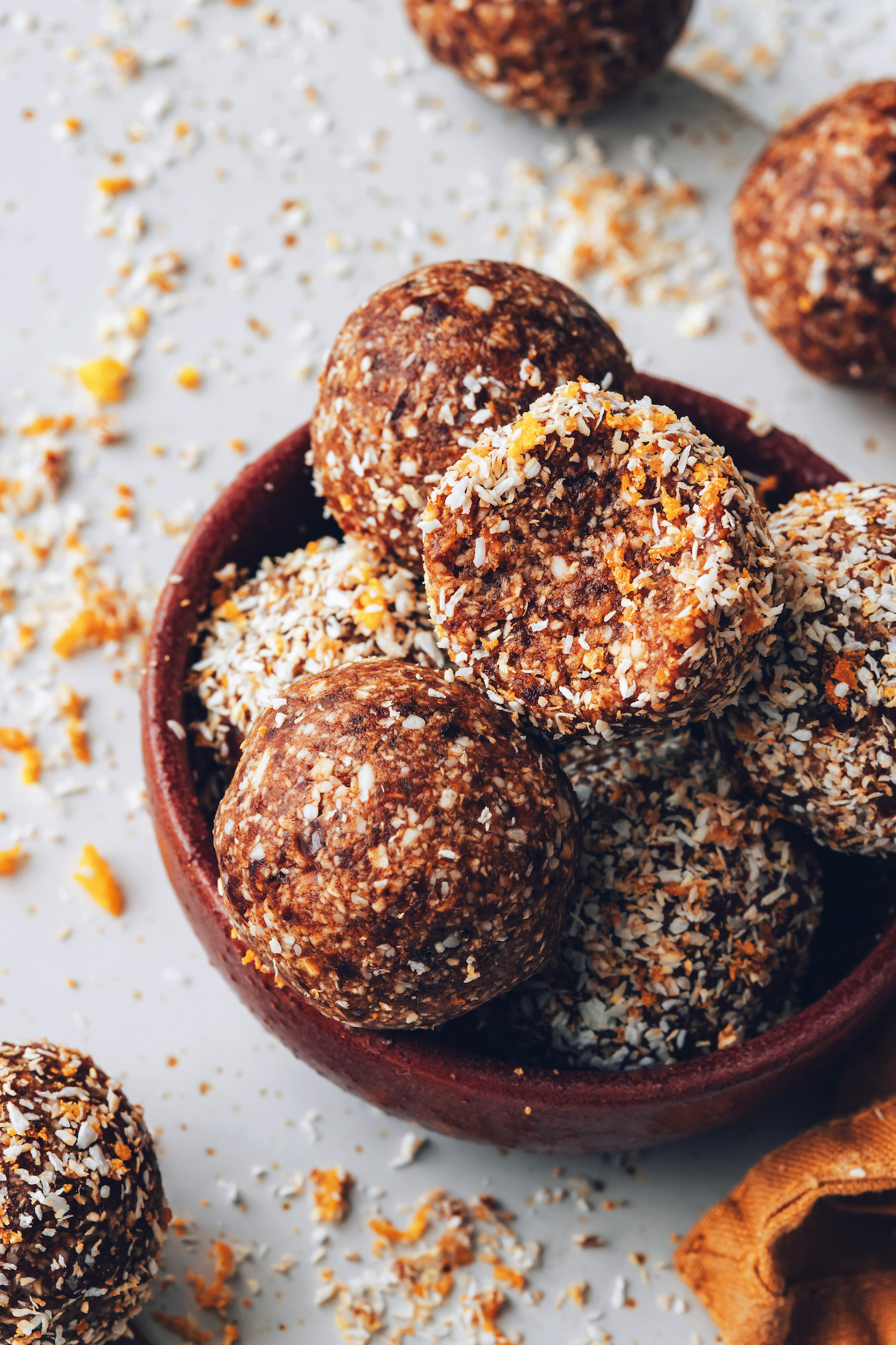 Bowl filled with cashew cardamom orange energy bites