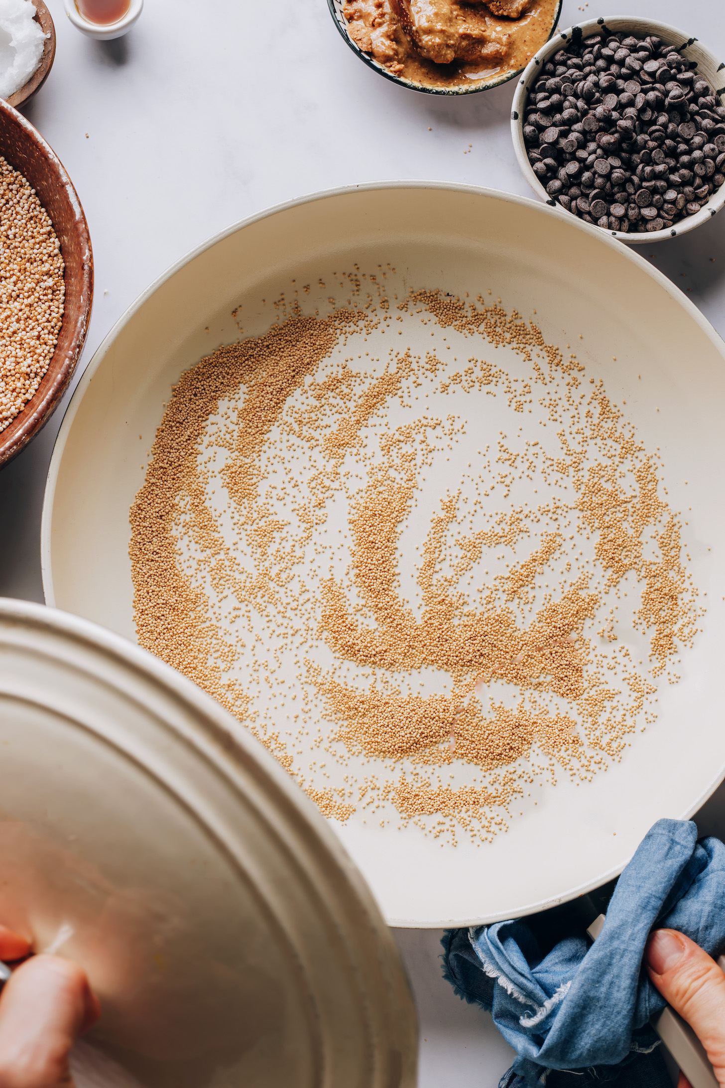 Dry amaranth in a skillet before turning it into puffed amaranth