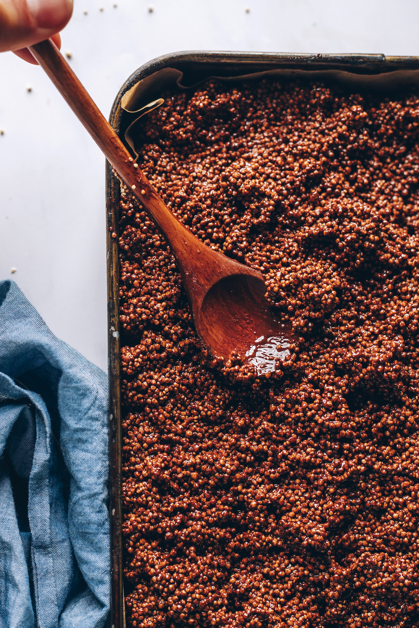 Wooden spoon in a pan of the chocolate amaranth mixture
