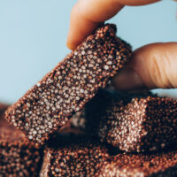 Picking up a chocolate amaranth bar from a stack