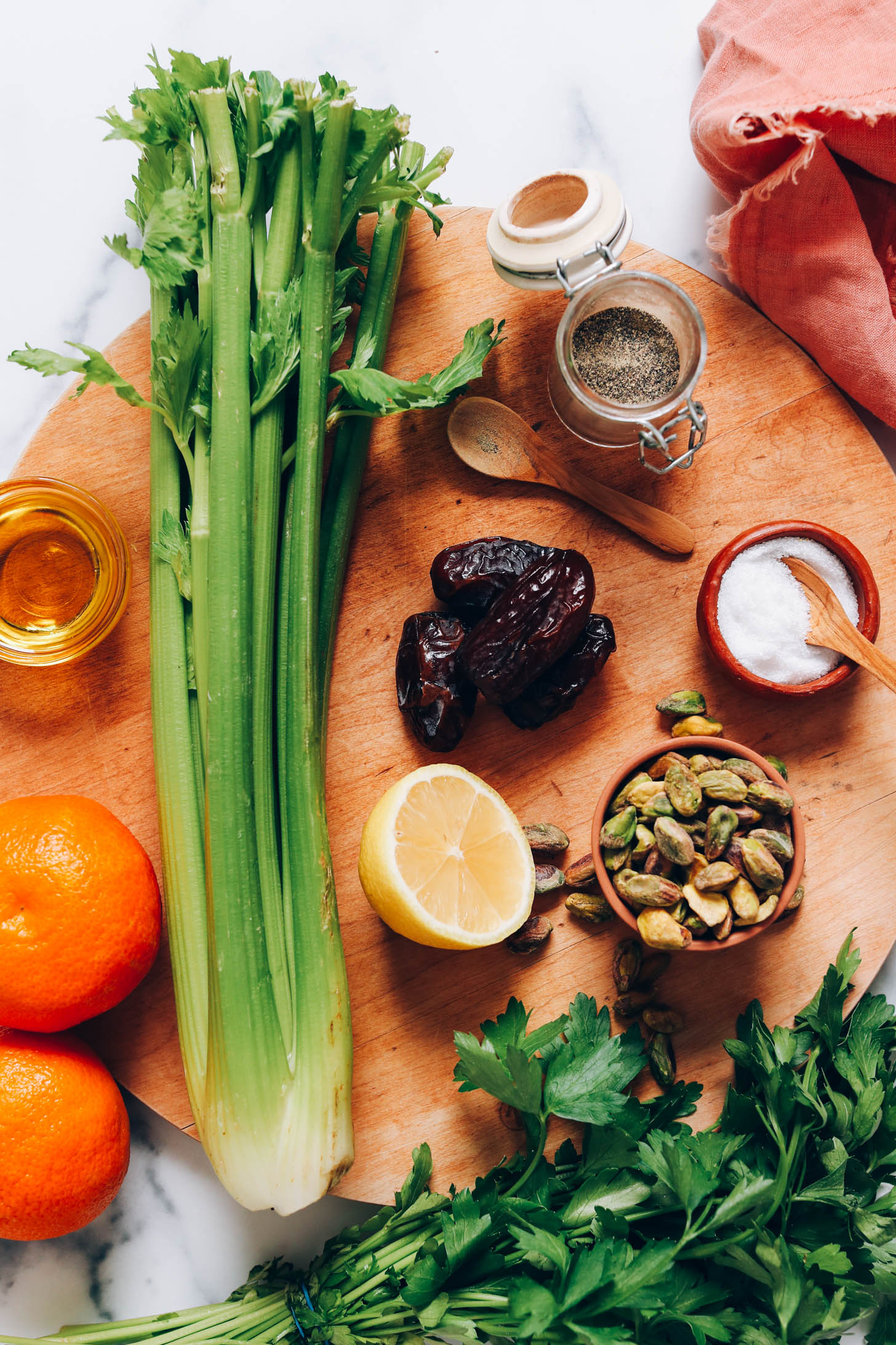 Mandarins, olive oil, celery, dates, lemon, parsley, pistachios, salt, and pepper