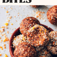 Overflowing bowl of vegan grain-free orange cardamom energy bites
