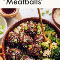 A bowl of vegan and gluten-free ginger sesame meatballs with broccoli and brown rice