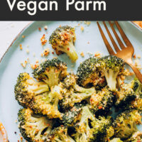 Plate of perfect roasted broccoli with vegan parmesan