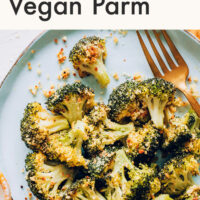 Plate of perfect roasted broccoli with vegan parmesan