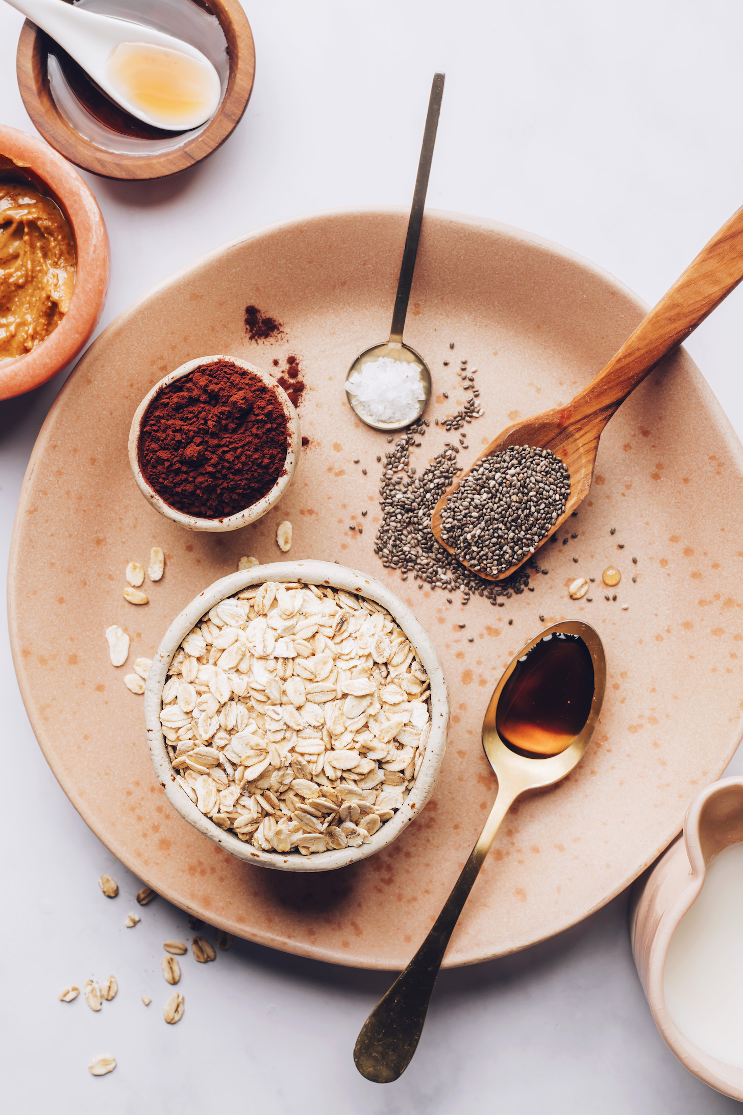 Maple syrup, nut butter, cocoa powder, salt, chia seeds, vanilla, and oats