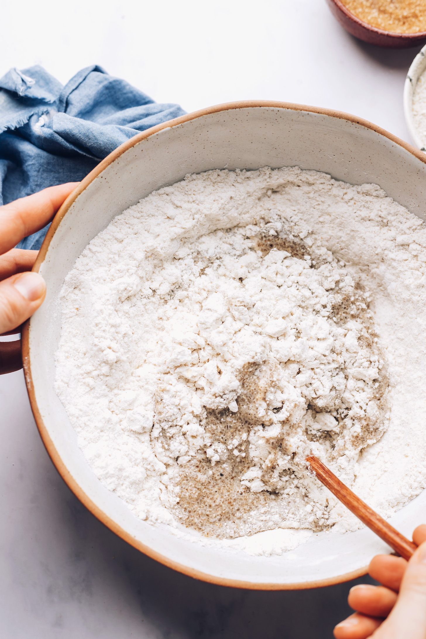 Stirring wet ingredients into dry