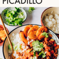 Bowl of easy vegan and gluten-free Cuban-inspired picadillo with plantains on the side
