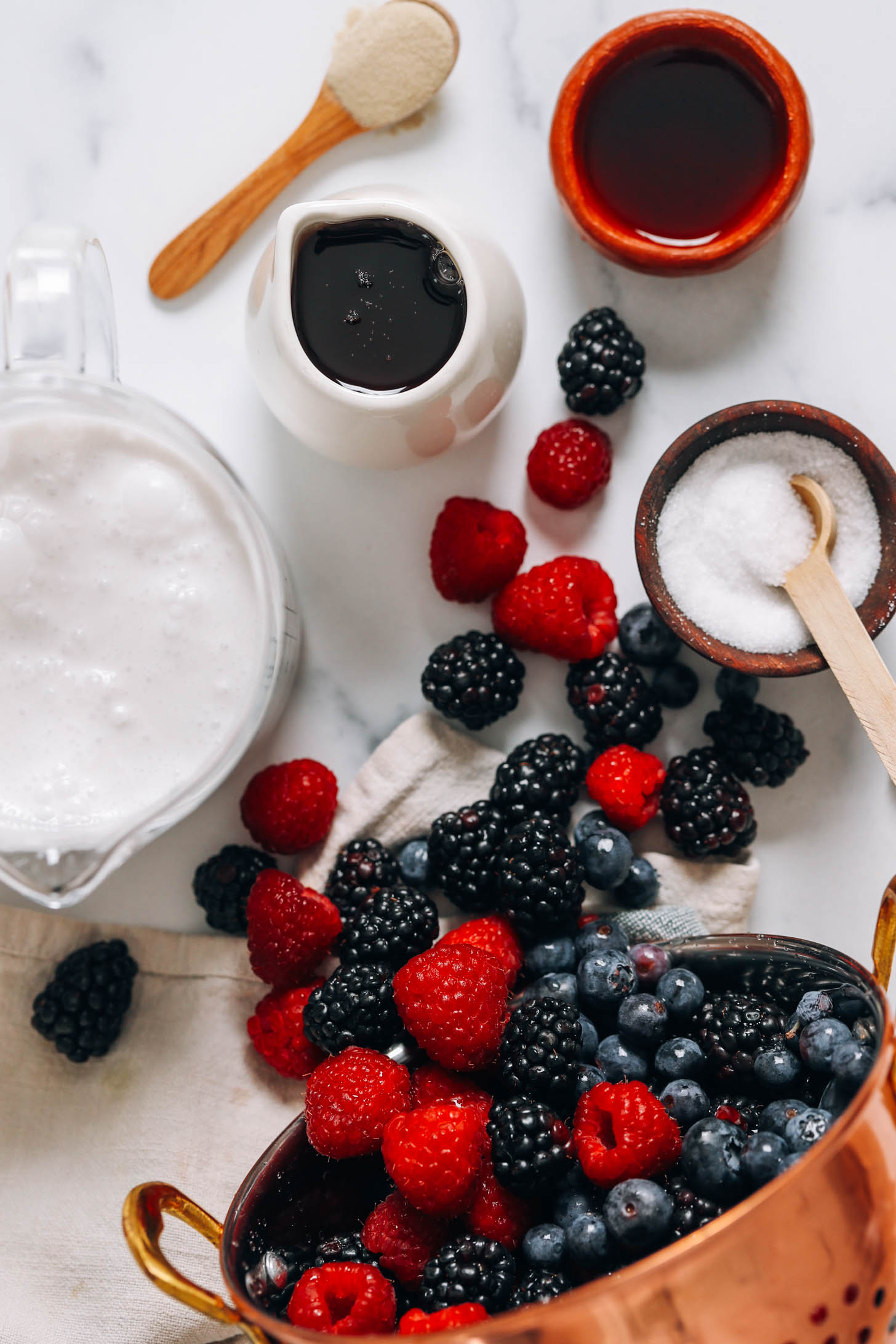 Coconut milk, maple syrup, agar agar, vanilla, salt, and mixed berries