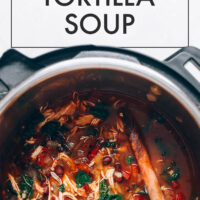 Spoon stirring a pot of easy chicken tortilla soup