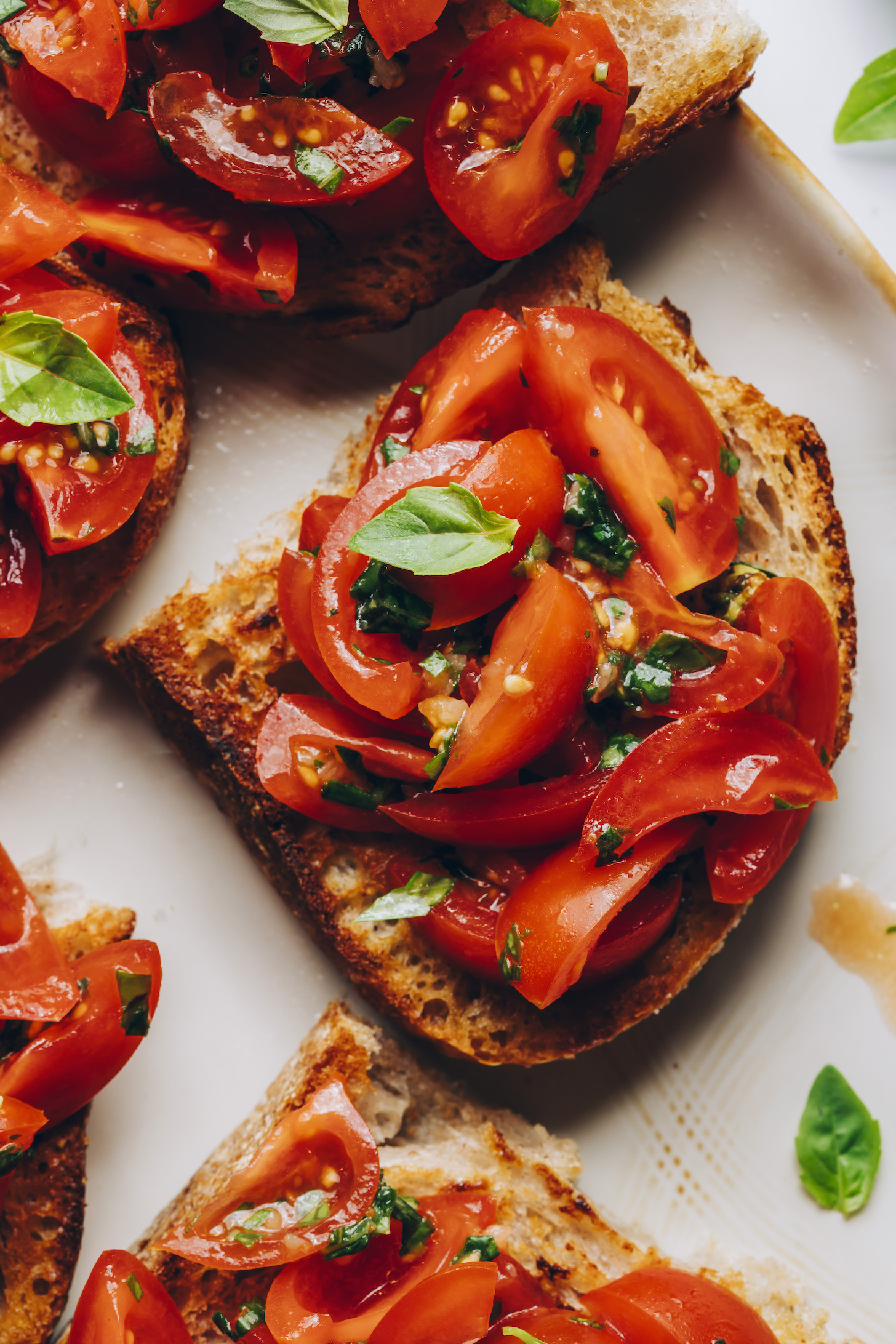 Close up shot of cherry tomato bruschetta on a plate