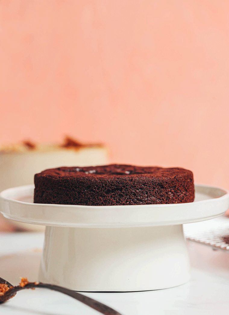 GIF showing spreading coconut pecan frosting between chocolate cake layers
