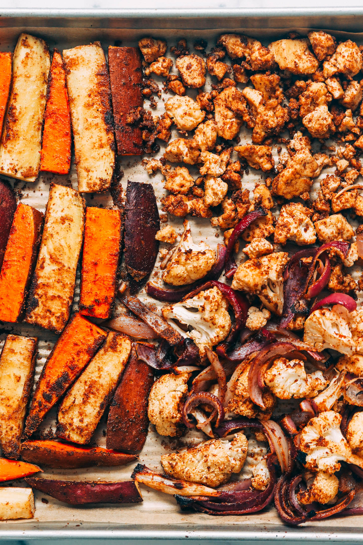Roasted sweet potatoes, cauliflower, and red onion seasoned with tandoori masala
