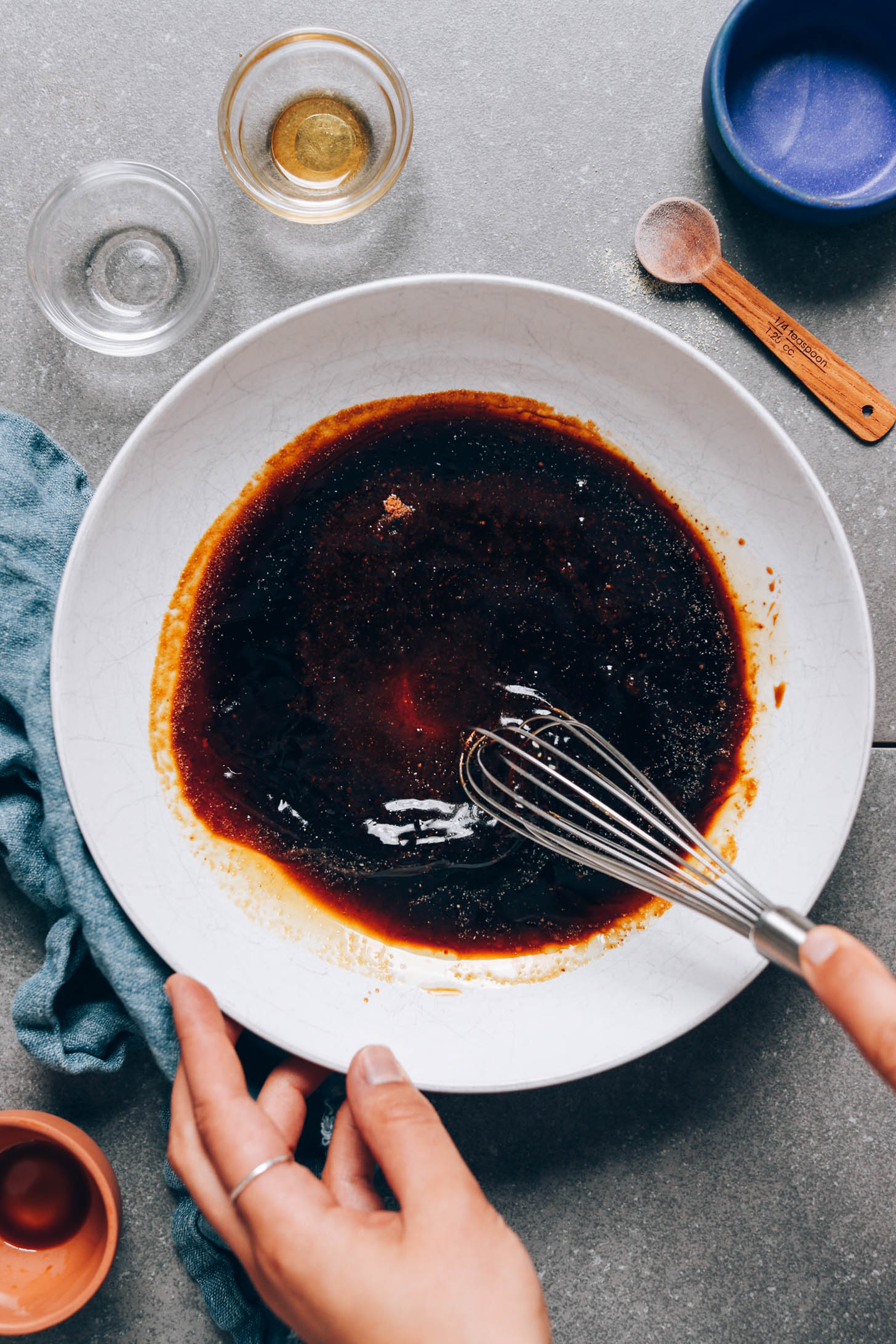 Whisking teriyaki sauce in a bowl