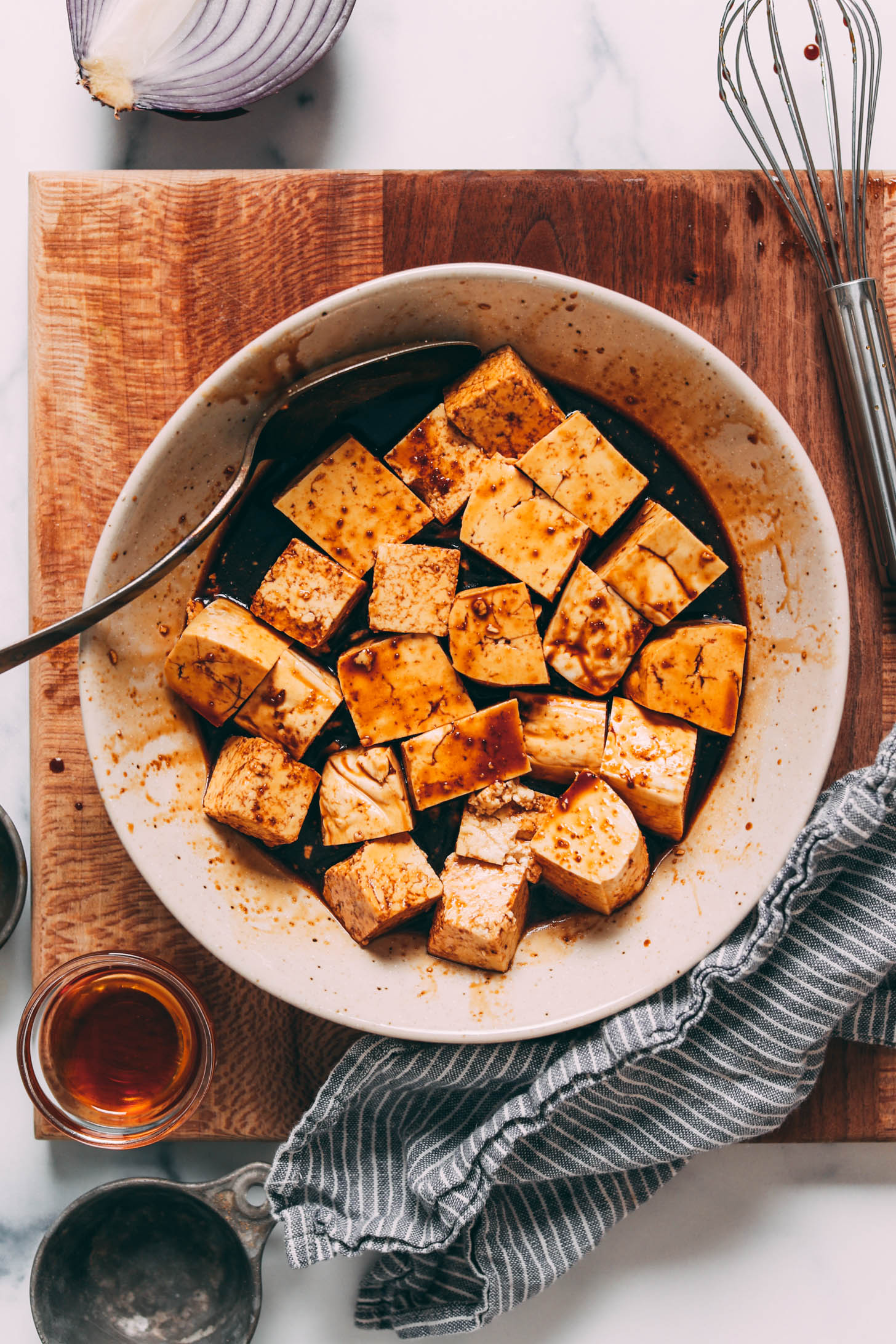 Cubed tofu marinating in teriyaki sauce