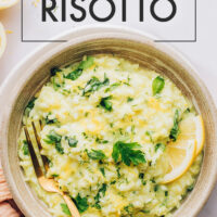 Bowl of vegan and gluten-free lemony risotto with fresh herbs and garlic