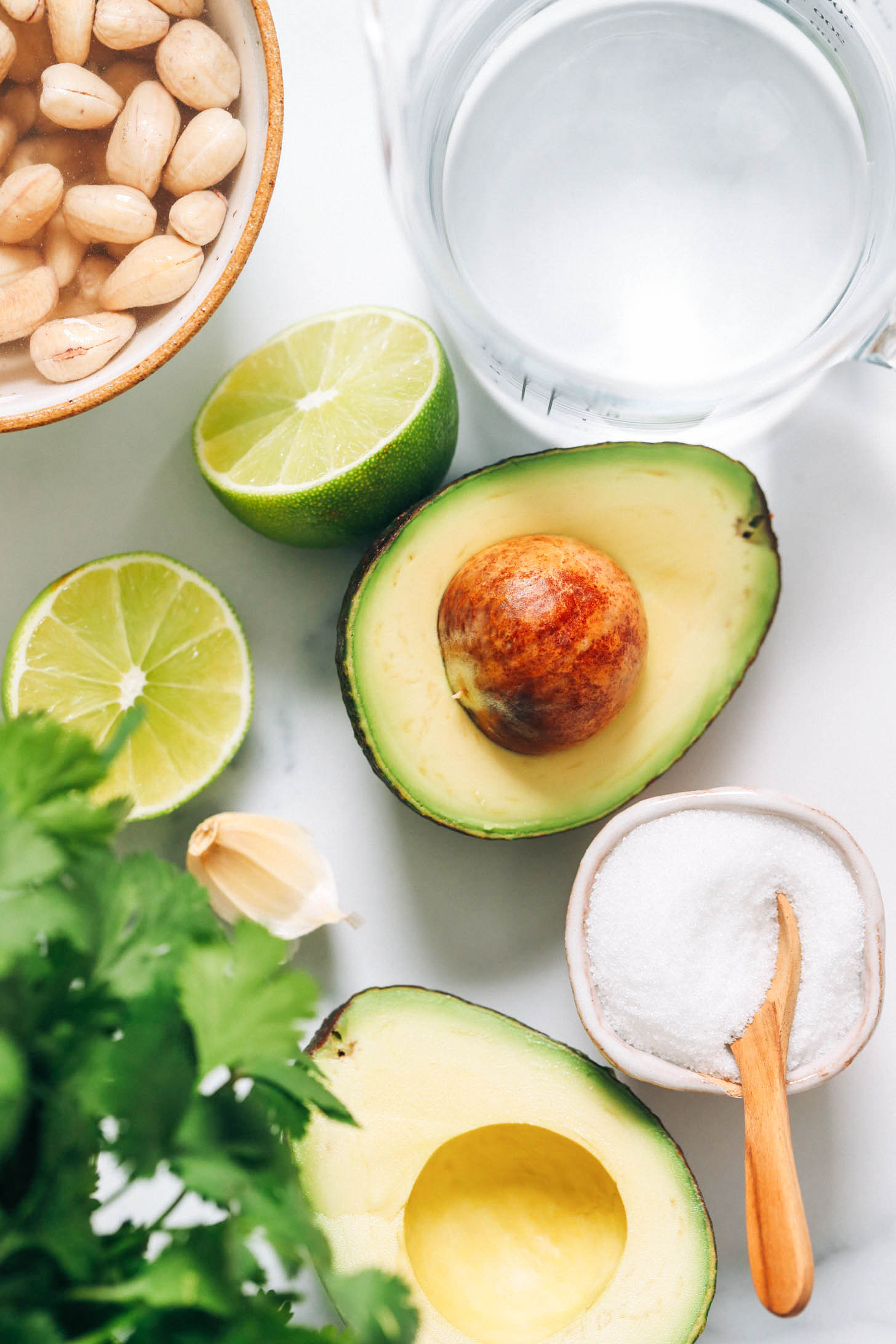 Avocado, cashews, limes, garlic, cilantro, salt, and water